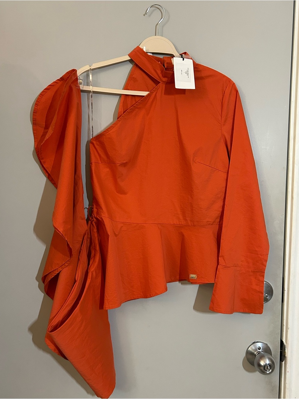 Lizette Collection One-Shoulder Asymmetrical Peplum Blouse in Orange - Picture 8 of 9